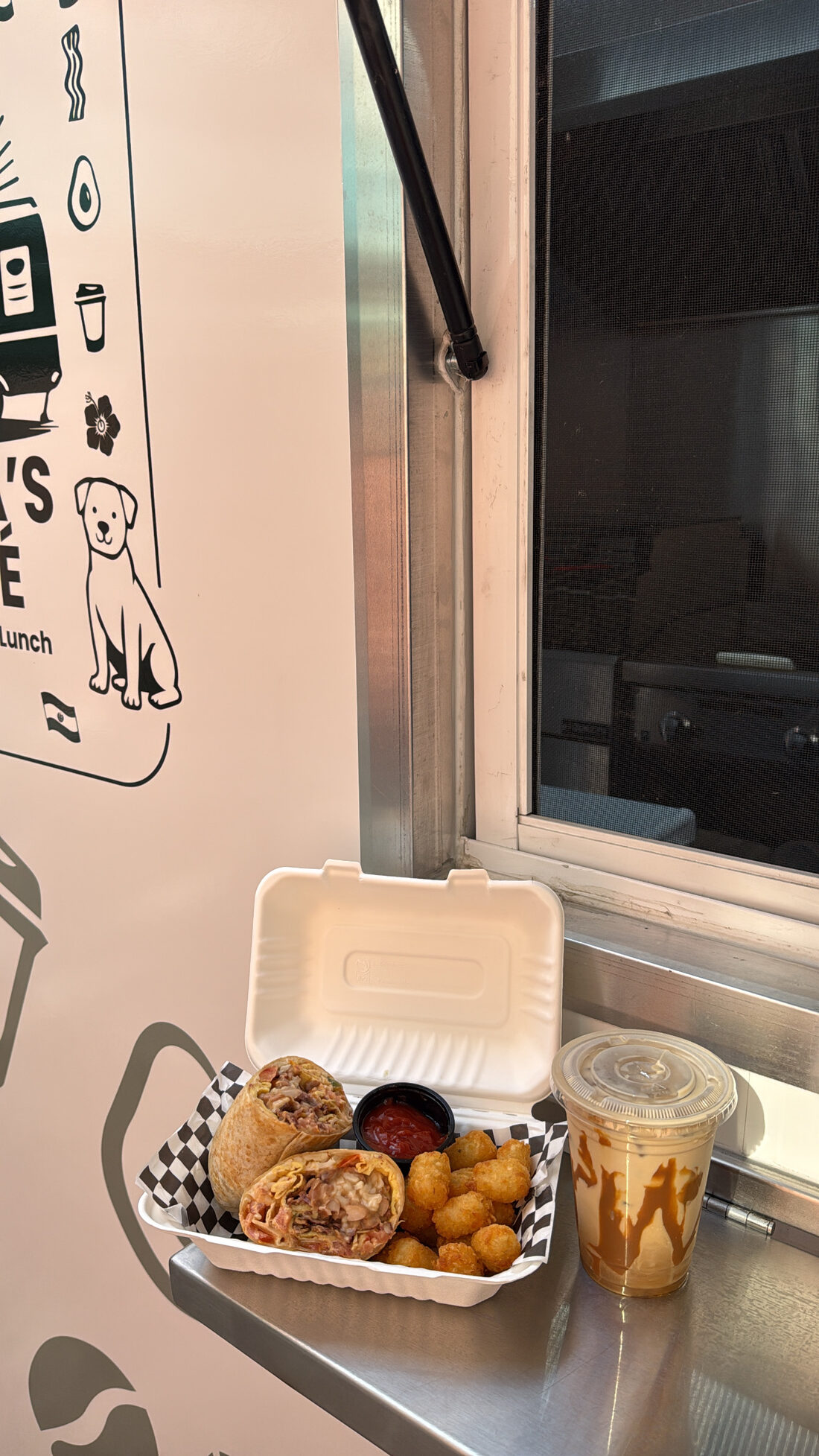 Burrito with tater tots and an iced coffee
